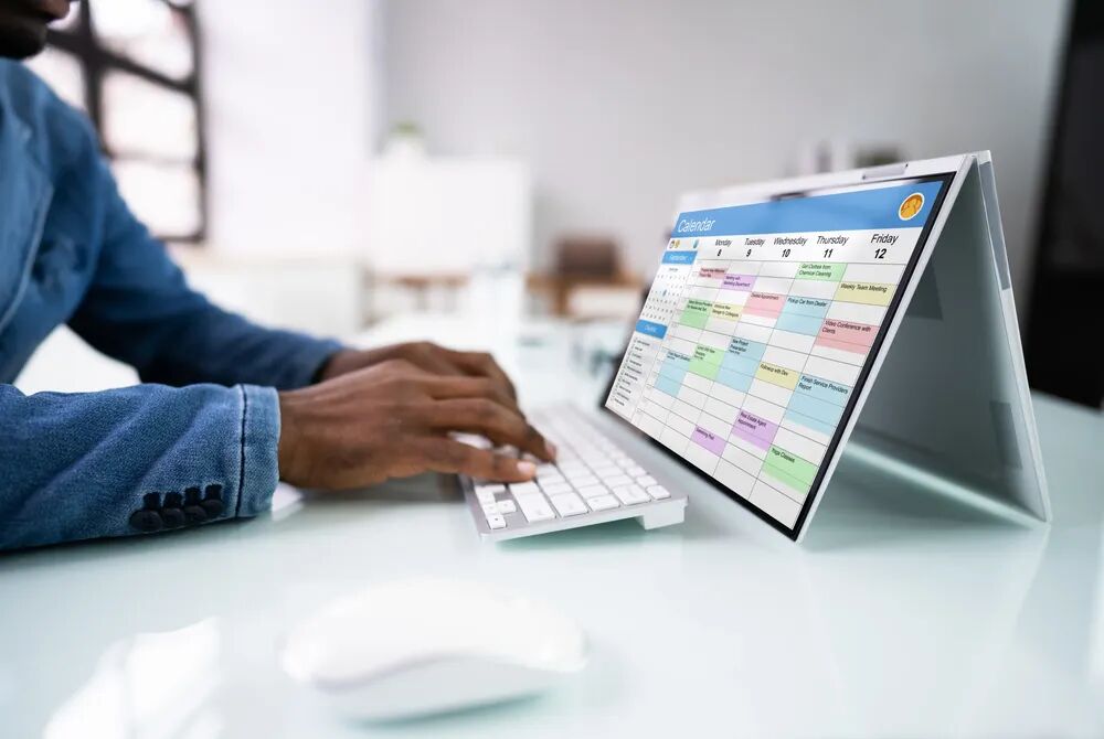Arranging a consultation appointment on a laptop calendar